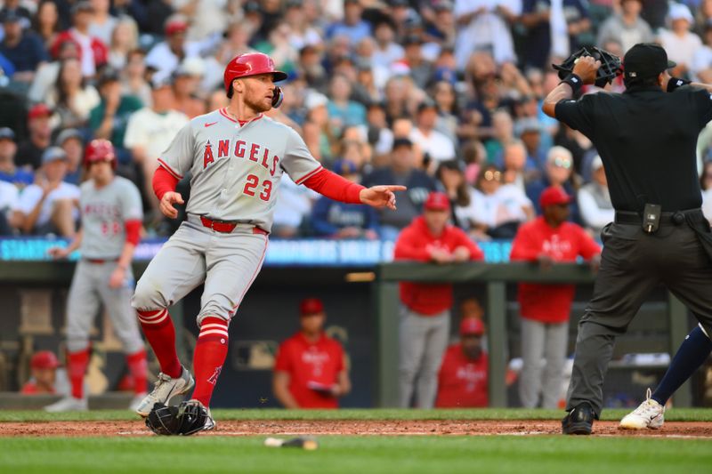 Jul 23, 2024; Seattle, Washington, USA; Los Angeles Angels second baseman Brandon Drury (23) scores a run against the Seattle Mariners during the fifth inning at T-Mobile Park. Mandatory Credit: Steven Bisig-USA TODAY Sports