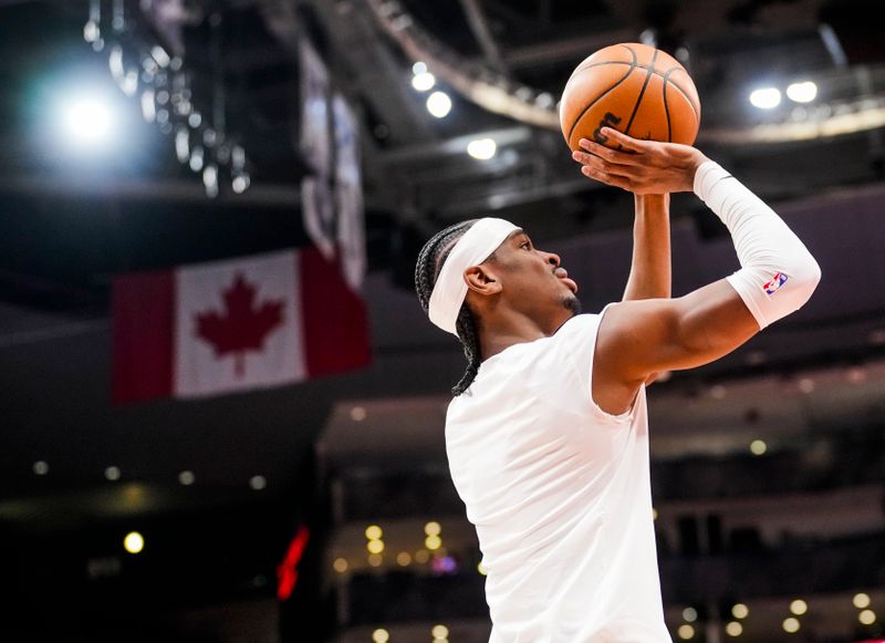 TORONTO, ON - MARCH 16: Shai Gilgeous-Alexander #2 of the Oklahoma City Thunder takes part in warm ups ahead of playing the Toronto Raptors at the Scotiabank Arena on March 16, 2023 in Toronto, Ontario, Canada. NOTE TO USER: User expressly acknowledges and agrees that, by downloading and/or using this Photograph, user is consenting to the terms and conditions of the Getty Images License Agreement. (Photo by Mark Blinch/Getty Images)