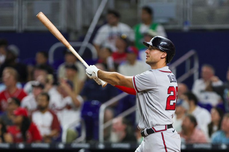 Sep 16, 2023; Miami, Florida, USA; Atlanta Braves first baseman Matt Olson (28) hits a home run against the Miami Marlins during the sixth inning at loanDepot Park. Mandatory Credit: Sam Navarro-USA TODAY Sports