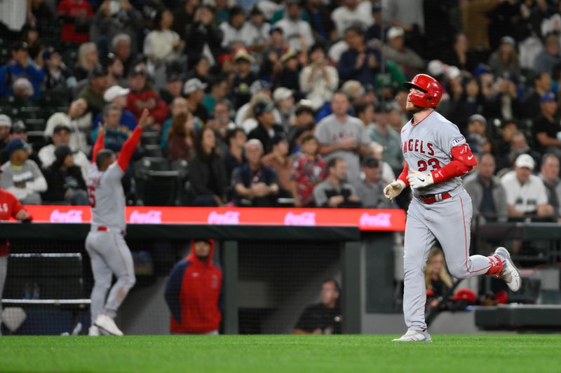 Sep 11, 2023; Seattle, Washington, USA; Los Angeles Angels second baseman Brandon Drury (23) heads toward home plate after hitting a two-run home run against the Seattle Mariners during the tenth inning at T-Mobile Park. Mandatory Credit: Steven Bisig-USA TODAY Sports