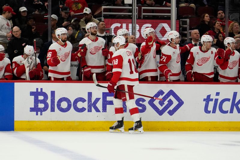 Nov 6, 2024; Chicago, Illinois, USA; Detroit Red Wings center Andrew Copp (18) celebrates his goal against the Chicago Blackhawks during the third period at United Center. Mandatory Credit: David Banks-Imagn Images