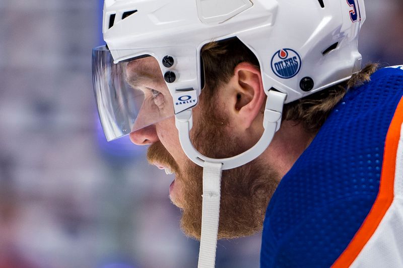 May 16, 2024; Vancouver, British Columbia, CAN; Edmonton Oilers forward Connor McDavid (97) rests in warm up prior to game five of the second round of the 2024 Stanley Cup Playoffs against the Vancouver Canucks at Rogers Arena. Mandatory Credit: Bob Frid-USA TODAY Sports