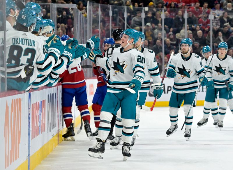 Jan 11, 2024; Montreal, Quebec, CAN; San Jose Sharks forward Fabian Zetterlund (20) celebrates with teammates after scoring a goal against the Montreal Canadiens during the first period at the Bell Centre. Mandatory Credit: Eric Bolte-USA TODAY Sports