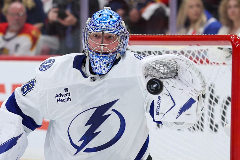 Apr 26, 2025; Sunrise, Florida, USA; Tampa Bay Lightning goaltender Andrei Vasilevskiy (88) makes a save against the Florida Panthers in the first period during game three of the first round of the 2025 Stanley Cup Playoffs at Amerant Bank Arena. Mandatory Credit: Nathan Ray Seebeck-Imagn Images