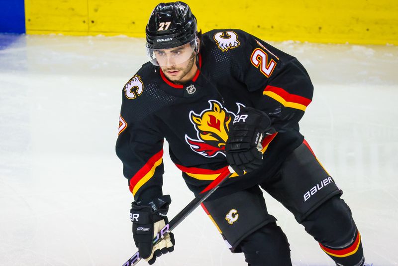 Jan 23, 2024; Calgary, Alberta, CAN; Calgary Flames right wing Matt Coronato (27) skates during the warmup period against the St. Louis Blues at Scotiabank Saddledome. Mandatory Credit: Sergei Belski-USA TODAY Sports