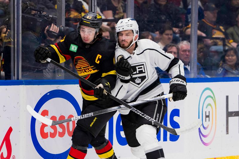 Feb 29, 2024; Vancouver, British Columbia, CAN; Los Angeles Kings defenseman Matt Roy (3) cehcks Vancouver Canucks defenseman Quinn Hughes (43) in the first period at Rogers Arena. Mandatory Credit: Bob Frid-USA TODAY Sports