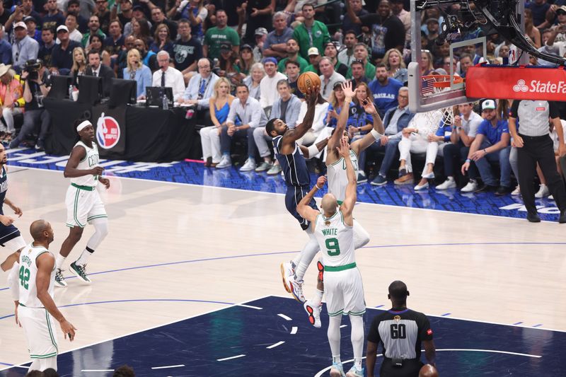 DALLAS, TX - JUNE 14: Kyrie Irving #11 of the Dallas Mavericks shoots the ball during the game against the Boston Celtics during Game 4 of the 2024 NBA Finals on June 14, 2024 at the American Airlines Center in Dallas, Texas. NOTE TO USER: User expressly acknowledges and agrees that, by downloading and or using this photograph, User is consenting to the terms and conditions of the Getty Images License Agreement. Mandatory Copyright Notice: Copyright 2024 NBAE (Photo by Joe Murphy/NBAE via Getty Images)