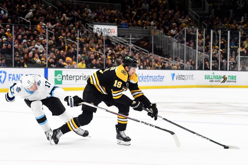 Nov 21, 2024; Boston, Massachusetts, USA;  Utah Hockey Club center Nick Bjugstad (17) tries to poke the puck from Boston Bruins center John Beecher (19) during the first period at TD Garden. Mandatory Credit: Bob DeChiara-Imagn Images