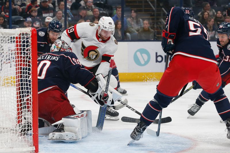 Dec 1, 2023; Columbus, Ohio, USA; Columbus Blue Jackets goalie Elvis Merzlikins (90) makes a save on the shot from Ottawa Senators center Rourke Chartier (49) during the third period at Nationwide Arena. Mandatory Credit: Russell LaBounty-USA TODAY Sports