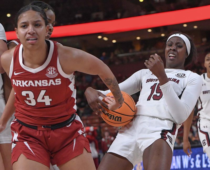 Mar 3, 2023; Greenville, SC, USA; Arkansas guard Chrissy Carr (34) and South Carolina forward Laeticia Amihere (15) get free from a tussle during the fourth quarter at Bon Secours Wellness Arena. Mandatory Credit: Ken Ruinard-USA TODAY Sports