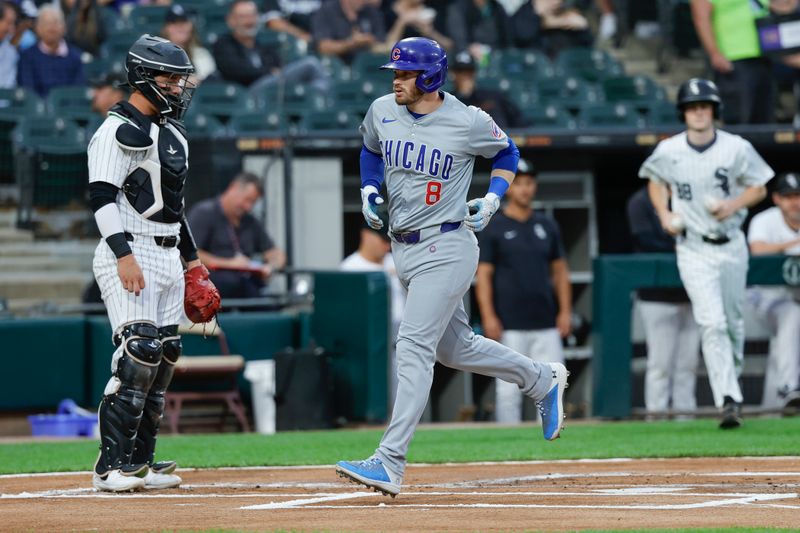 Aug 9, 2024; Chicago, Illinois, USA; Chicago Cubs outfielder Ian Happ (8) crosses home plate after hitting a solo home run against the Chicago White Sox during the first inning at Guaranteed Rate Field. Mandatory Credit: Kamil Krzaczynski-USA TODAY Sports