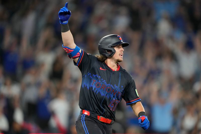 Aug 23, 2024; Toronto, Ontario, CAN; Toronto Blue Jays third baseman Addison Barger (47) reacts as he runs out his walk off solo home run against the Los Angeles Angels during the ninth inning at Rogers Centre. Mandatory Credit: John E. Sokolowski-USA TODAY Sports