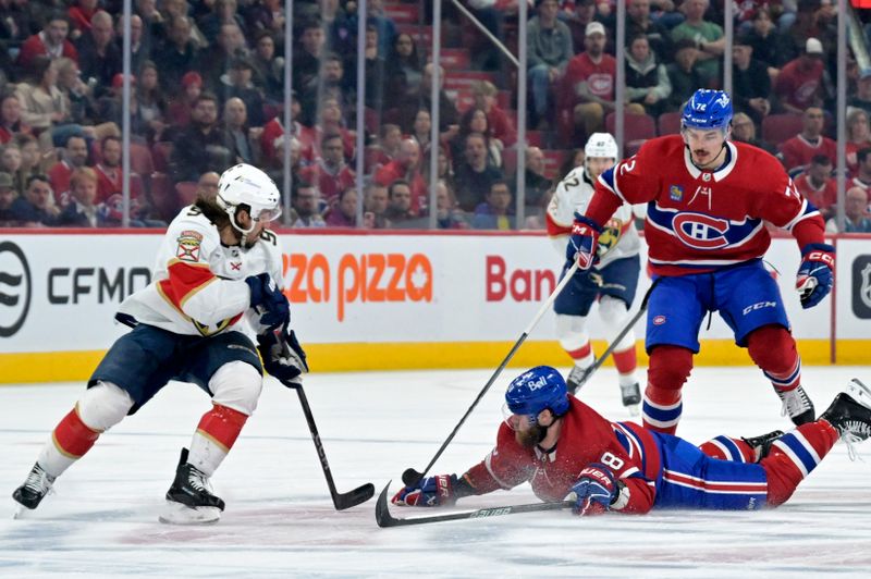 Apr 2, 2024; Montreal, Quebec, CAN; Montreal Canadiens defenseman David Savard (58) poke checks the puck away from Florida Panthers forward Ryan Lomberg (94) during the first period at the Bell Centre. Mandatory Credit: Eric Bolte-USA TODAY Sports