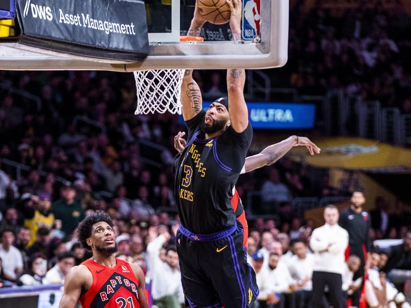 LOS ANGELES, CA - JANUARY 9: Anthony Davis #3 of the Los Angeles Lakers drives to the basket during the game against the Toronto Raptors on January 9, 2024 at Crypto.Com Arena in Los Angeles, California. NOTE TO USER: User expressly acknowledges and agrees that, by downloading and/or using this Photograph, user is consenting to the terms and conditions of the Getty Images License Agreement. Mandatory Copyright Notice: Copyright 2024 NBAE (Photo by Tyler Ross/NBAE via Getty Images)