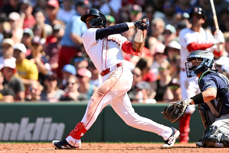 Jul 13, 2025; Boston, Massachusetts, USA; Boston Red Sox outfielder Ceddanne Rafaela (3) hits a two-run home run against the Tampa Bay Rays during the sixth inning  at Fenway Park. Mandatory Credit: Brian Fluharty-Imagn Images