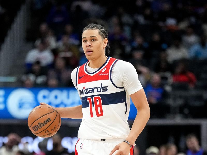 DETROIT, MICHIGAN - MARCH 11: Kyshawn George #18 of the Washington Wizards handles the ball against the Detroit Pistons during the second quarter at Little Caesars Arena on March 11, 2025 in Detroit, Michigan. NOTE TO USER: User expressly acknowledges and agrees that, by downloading and or using this photograph, User is consenting to the terms and conditions of the Getty Images License Agreement. (Photo by Nic Antaya/Getty Images)