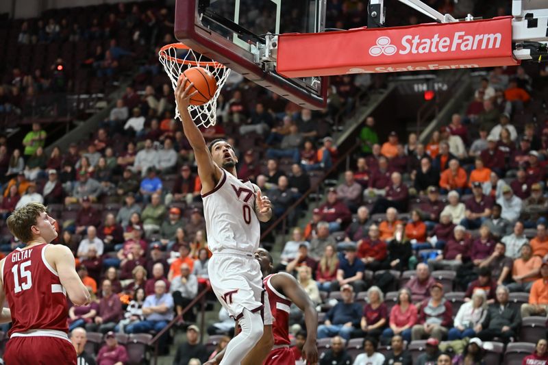 Jan 7, 2026; Blacksburg, Virginia, USA;  Virginia Tech Hokies guard Jailen Bedford (0) lays the ball up as Stanford Cardinal forward Oskar Giltay (15) looks on during the first half at Cassell Coliseum. Mandatory Credit: Brian Bishop-Imagn Images