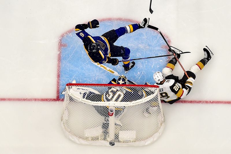 Dec 6, 2023; St. Louis, Missouri, USA;  Vegas Golden Knights left wing William Carrier (28) collides with St. Louis Blues goaltender Jordan Binnington (50) and defenseman Marco Scandella (6) during the second period at Enterprise Center. Mandatory Credit: Jeff Curry-USA TODAY Sports