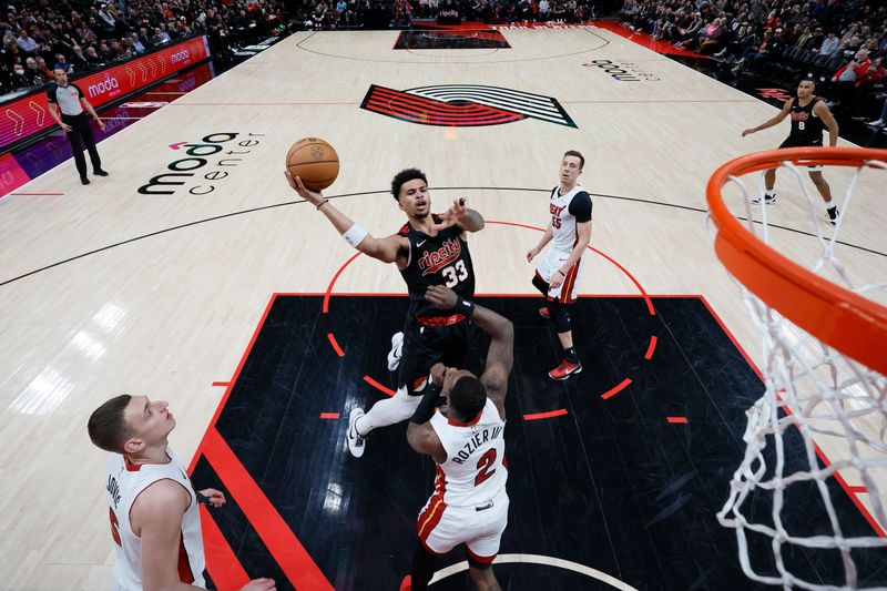 PORTLAND, OREGON - FEBRUARY 27: Toumani Camara #33 of the Portland Trail Blazers shoots the ball against Terry Rozier #2 of the Miami Heat during the first half at Moda Center on February 27, 2024 in Portland, Oregon. NOTE TO USER: User expressly acknowledges and agrees that, by downloading and or using this photograph, User is consenting to the terms and conditions of the Getty Images License Agreement. (Photo by Soobum Im/Getty Images)