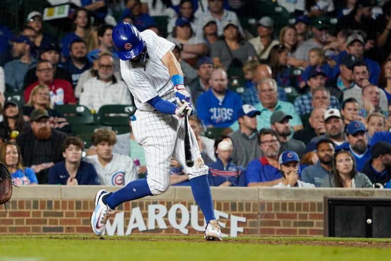 Sep 21, 2023; Chicago, Illinois, USA; Chicago Cubs shortstop Dansby Swanson (7) hits a one run single against the Pittsburgh Pirates during the seventh inning at Wrigley Field. Mandatory Credit: David Banks-USA TODAY Sports