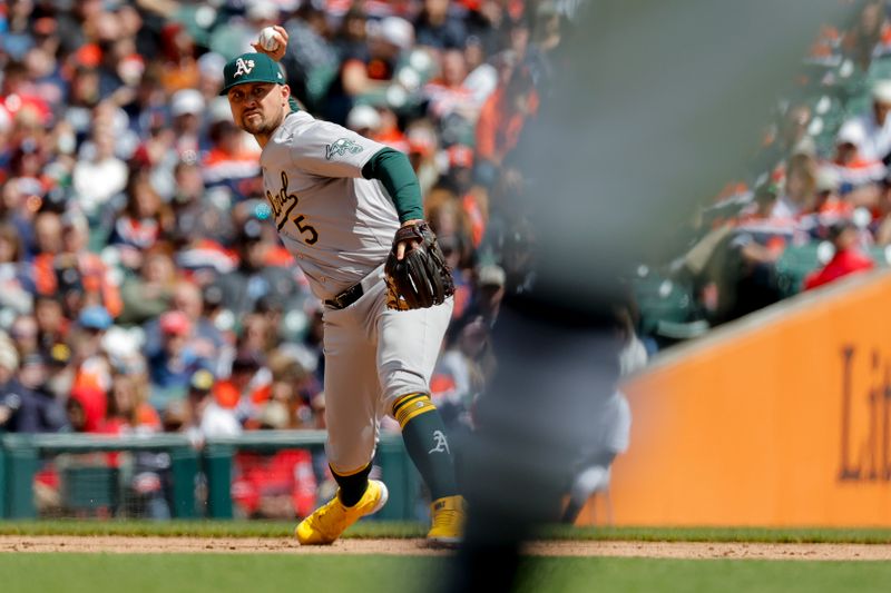 Apr 6, 2024; Detroit, Michigan, USA;  Oakland Athletics third baseman J.D. Davis (5) makes a throw to first base against the Detroit Tigers in the sixth inning at Comerica Park. Mandatory Credit: Rick Osentoski-USA TODAY Sports