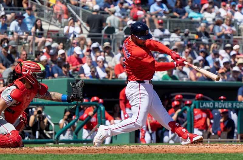 Mar 11, 2025; Fort Myers, Florida, USA;  Boston Red Sox Alex Bregman (2) connects with the ball in the first inning of their game with the Phillies  at JetBlue Park at Fenway South. Mandatory Credit: Chris Tilley-Imagn Images