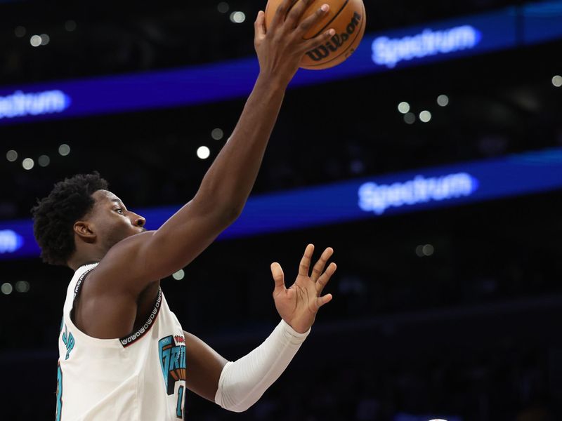 LOS ANGELES, CALIFORNIA - NOVEMBER 13: Jaren Jackson Jr. #13 of the Memphis Grizzlies shoots the ball in front of Anthony Davis #3 of the Los Angeles Lakers during the third quarter at Crypto.com Arena on November 13, 2024 in Los Angeles, California. NOTE TO USER: User expressly acknowledges and agrees that, by downloading and or using this photograph, User is consenting to the terms and conditions of the Getty Images License Agreement.  (Photo by Harry How/Getty Images)