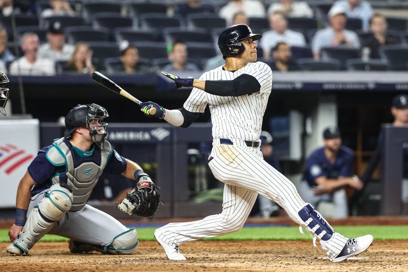 May 22, 2024; Bronx, New York, USA;  New York Yankees right fielder Juan Soto (22) hits his second home run of the game in the sixth inning against the Seattle Mariners at Yankee Stadium. Mandatory Credit: Wendell Cruz-USA TODAY Sports