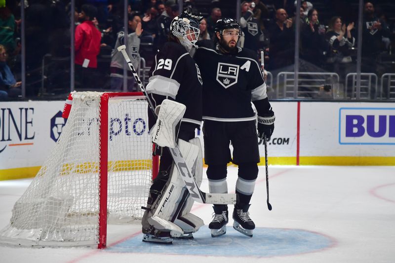 Mar 16, 2023; Los Angeles, California, USA; Los Angeles Kings goaltender Pheonix Copley (29) and defenseman Drew Doughty (8) celebrate the victory against the Columbus Blue Jackets at Crypto.com Arena. Mandatory Credit: Gary A. Vasquez-USA TODAY Sports