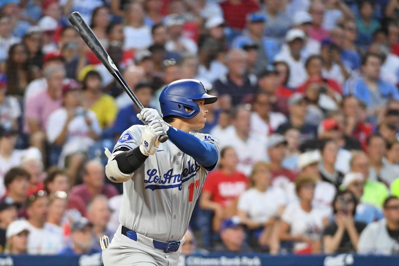 Jul 10, 2024; Philadelphia, Pennsylvania, USA;  Los Angeles Dodgers two-way player Shohei Ohtani (17) hits an RBI single during the fifth inning against the Philadelphia Phillies  at Citizens Bank Park. Mandatory Credit: Eric Hartline-USA TODAY Sports