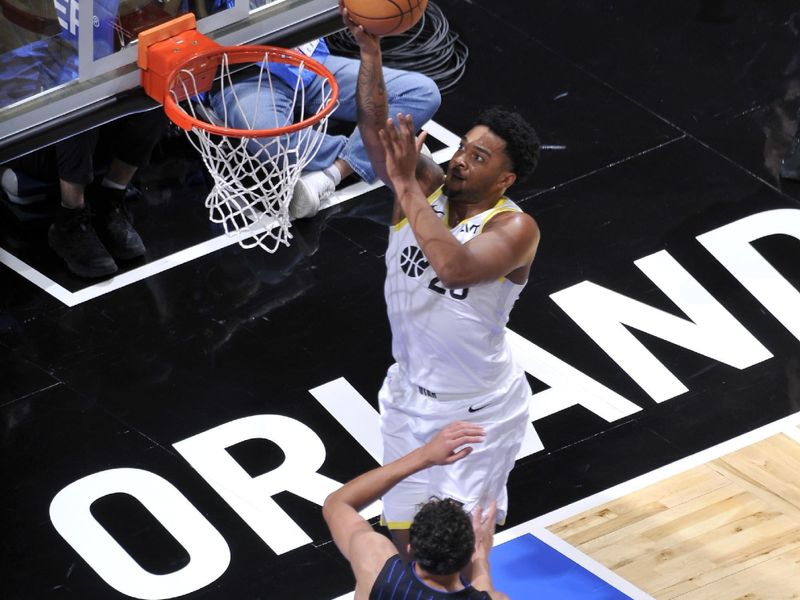 ORLANDO, FL - JANUARY 5 :  Brice Sensabaugh #28 of the Utah Jazz drives to the basket during the game against the Orlando Magic on January 5, 2025 at Kia Center in Orlando, Florida. NOTE TO USER: User expressly acknowledges and agrees that, by downloading and or using this photograph, User is consenting to the terms and conditions of the Getty Images License Agreement. Mandatory Copyright Notice: Copyright 2025 NBAE (Photo by Fernando Medina/NBAE via Getty Images)