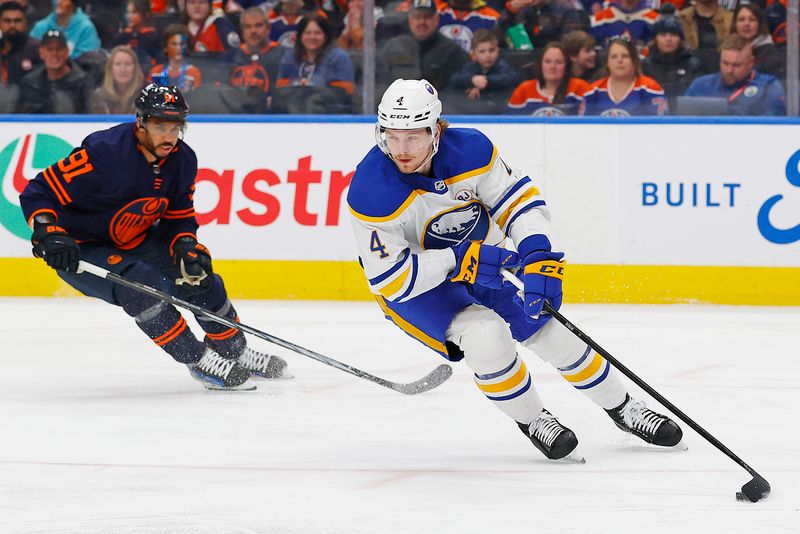 Mar 21, 2024; Edmonton, Alberta, CAN; Buffalo Sabres defensemen Bowen Byron (4) moves the puck in front of Edmonton Oilers forward Evander Kane (91) during the first period at Rogers Place. Mandatory Credit: Perry Nelson-USA TODAY Sports