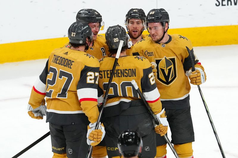 Mar 23, 2024; Las Vegas, Nevada, USA; Vegas Golden Knights center Jack Eichel (9) celebrates with team mates after scoring a goal against the Columbus Blue Jackets during the third period at T-Mobile Arena. Mandatory Credit: Stephen R. Sylvanie-USA TODAY Sports