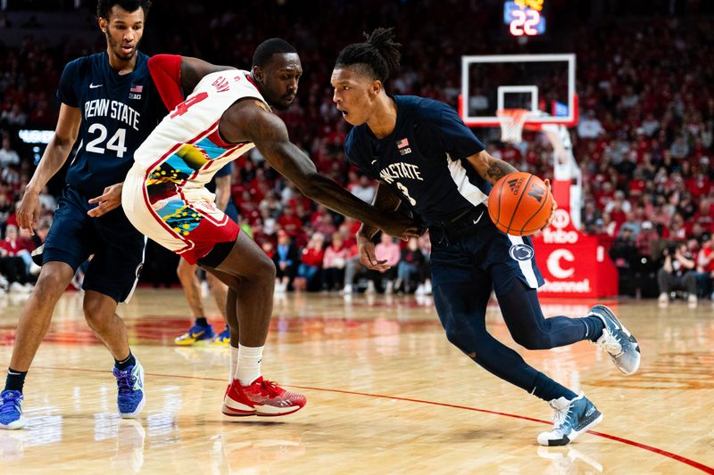 Feb 17, 2024; Lincoln, Nebraska, USA; Penn State Nittany Lions guard Nick Kern Jr. (3) drives against Nebraska Cornhuskers forward Juwan Gary (4) during the second half at Pinnacle Bank Arena. Mandatory Credit: Dylan Widger-USA TODAY Sports