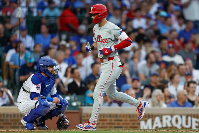 Jul 2, 2024; Chicago, Illinois, USA; Philadelphia Phillies shortstop Trea Turner (7) crosses home plate after hitting a solo home run against the Chicago Cubs during the third inning at Wrigley Field. Mandatory Credit: Kamil Krzaczynski-USA TODAY Sports