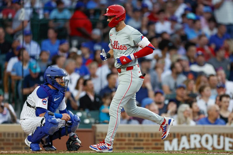 Jul 2, 2024; Chicago, Illinois, USA; Philadelphia Phillies shortstop Trea Turner (7) crosses home plate after hitting a solo home run against the Chicago Cubs during the third inning at Wrigley Field. Mandatory Credit: Kamil Krzaczynski-USA TODAY Sports