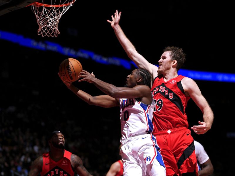 TORONTO, CANADA - OCTOBER 25: Tyrese Maxey #0 of the Philadelphia 76ers drives to the basket during the game against the Toronto Raptors on October 25, 2024 at the Scotiabank Arena in Toronto, Ontario, Canada.  NOTE TO USER: User expressly acknowledges and agrees that, by downloading and or using this Photograph, user is consenting to the terms and conditions of the Getty Images License Agreement.  Mandatory Copyright Notice: Copyright 2024 NBAE (Photo by Mark Blinch/NBAE via Getty Images)