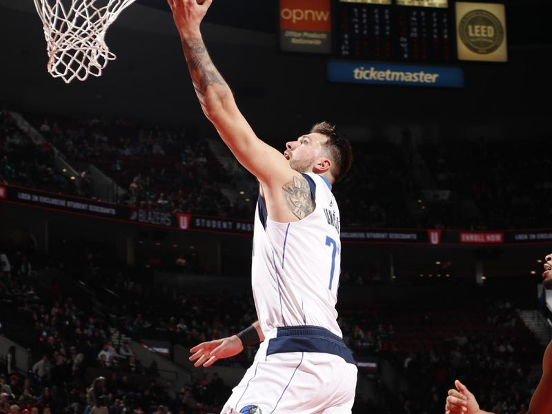 PORTLAND, OR - DECEMBER 1: Luka Doncic #77 of the Dallas Mavericks drives to the basket during the game against the Portland Trail Blazers on December 1, 2024 at the Moda Center Arena in Portland, Oregon. NOTE TO USER: User expressly acknowledges and agrees that, by downloading and or using this photograph, user is consenting to the terms and conditions of the Getty Images License Agreement. Mandatory Copyright Notice: Copyright 2024 NBAE (Photo by Cameron Browne/NBAE via Getty Images)