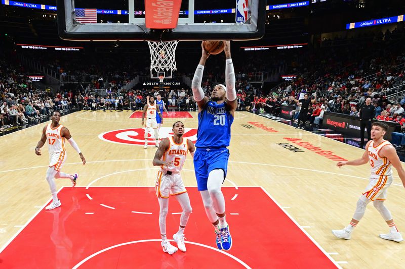 ATLANTA, GA - JANUARY 26: Richaun Holmes #20 of the Dallas Mavericks drives to the basket during the game against the Atlanta Hawks on January 26, 2024 at State Farm Arena in Atlanta, Georgia.  NOTE TO USER: User expressly acknowledges and agrees that, by downloading and/or using this Photograph, user is consenting to the terms and conditions of the Getty Images License Agreement. Mandatory Copyright Notice: Copyright 2024 NBAE (Photo by Adam Hagy/NBAE via Getty Images)