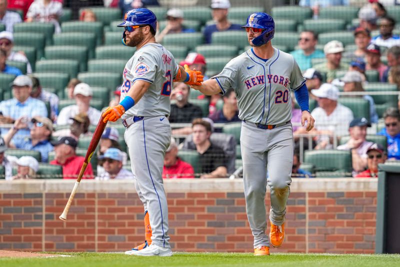 Apr 11, 2024; Cumberland, Georgia, USA; New York Mets first baseman Pete Alonso (20) reacts with designated hitter DJ Stewart (29) after scoring a run against the Atlanta Braves during the seventh inning at Truist Park. Mandatory Credit: Dale Zanine-USA TODAY Sports