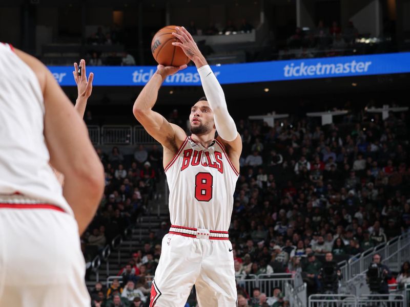 MILWAUKEE, WI - NOVEMBER 20: Zach LaVine #8 of the Chicago Bulls three point basket during the game against the Milwaukee Bucks on November 20, 2024 at the Fiserv Forum Center in Milwaukee, Wisconsin. NOTE TO USER: User expressly acknowledges and agrees that, by downloading and or using this Photograph, user is consenting to the terms and conditions of the Getty Images License Agreement. Mandatory Copyright Notice: Copyright 2024 NBAE (Photo by Gary Dineen/NBAE via Getty Images).