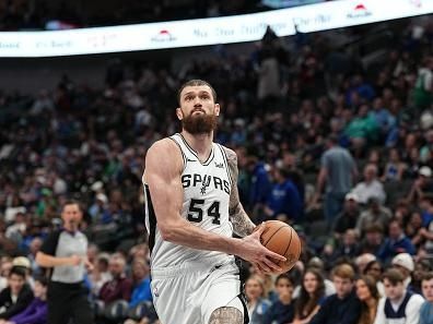 DALLAS, TX - DECEMBER 23: Sandro Mamukelashvili #54 of the San Antonio Spurs drives to the basket during the game against the Dallas Mavericks on December 23, 2023 at the American Airlines Center in Dallas, Texas. NOTE TO USER: User expressly acknowledges and agrees that, by downloading and or using this photograph, User is consenting to the terms and conditions of the Getty Images License Agreement. Mandatory Copyright Notice: Copyright 2023 NBAE (Photo by Glenn James/NBAE via Getty Images)