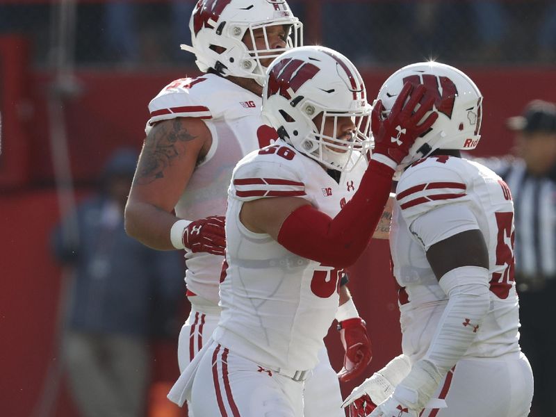 Nov 16, 2019; Lincoln, NE, USA; Wisconsin Badgers linebacker Zack Baun (56) and linebacker Chris Orr (54) celebrate during the game against the Nebraska Cornhuskers in the first half at Memorial Stadium. Mandatory Credit: Bruce Thorson-USA TODAY Sports