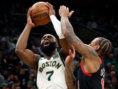 Boston, MA - November 28: Boston Celtics SG Jaylen Brown absorbs contact from Chicago Bulls SF DeMar DeRozan in the second half. The Celtics beat the Bulls, 124-97. (Photo by Danielle Parhizkaran/The Boston Globe via Getty Images)