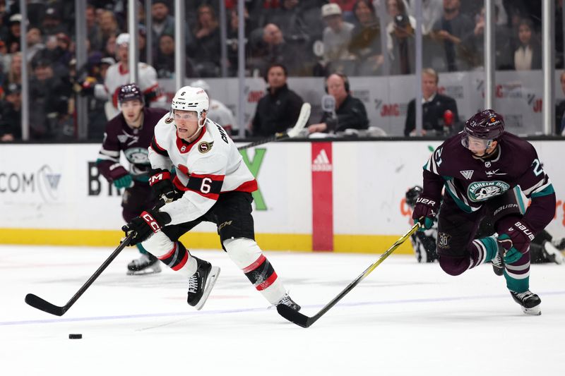 Mar 6, 2024; Anaheim, California, USA;  Ottawa Senators defenseman Jakob Chychrun (6) skates with the puck in front of Anaheim Ducks center Isac Lundestrom (21) during the third period at Honda Center. Mandatory Credit: Kiyoshi Mio-USA TODAY Sports