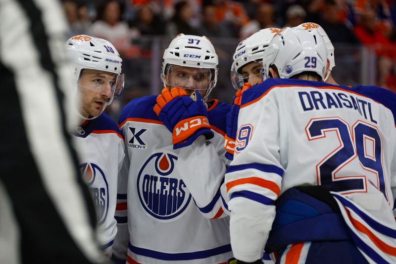 Oct 27, 2024; Detroit, Michigan, USA; The Edmonton Oilers huddle during the third period of the game against the Detroit Red Wings at Little Caesars Arena. Mandatory Credit: Brian Bradshaw Sevald-Imagn Images