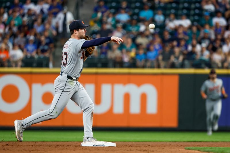 Aug 8, 2024; Seattle, Washington, USA; Detroit Tigers second baseman Colt Keith (33) turns a double play against the Seattle Mariners during the seventh inning at T-Mobile Park. Mandatory Credit: Joe Nicholson-USA TODAY Sports