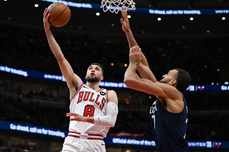 CHICAGO, ILLINOIS - MARCH 17: Zach LaVine #8 of the Chicago Bulls scores in the second half against Rudy Gobert #27 of the Minnesota Timberwolves at United Center on March 17, 2023 in Chicago, Illinois.  NOTE TO USER: User expressly acknowledges and agrees that, by downloading and or using this photograph, User is consenting to the terms and conditions of the Getty Images License Agreement.  (Photo by Quinn Harris/Getty Images)