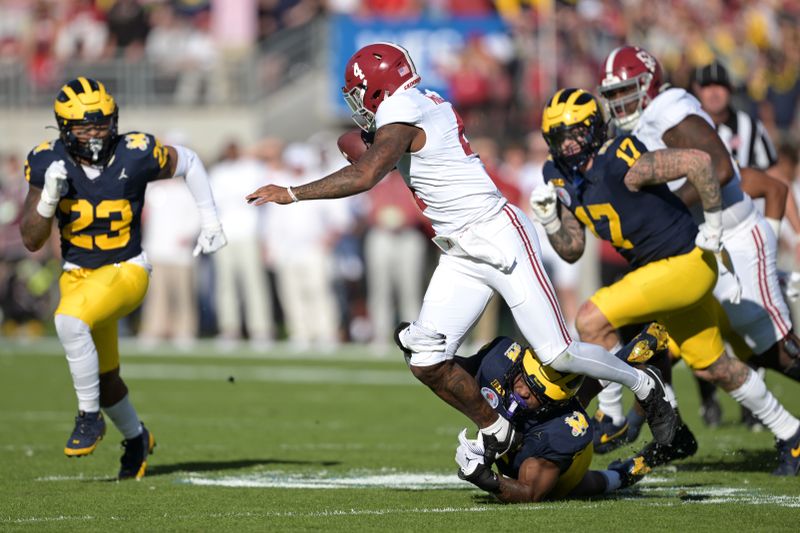 Jan 1, 2024; Pasadena, CA, USA; Alabama Crimson Tide quarterback Jalen Milroe (4) is sacked by Michigan Wolverines defensive end Josaiah Stewart (5) during the first half in the 2024 Rose Bowl college football playoff semifinal game at Rose Bowl. Mandatory Credit: Jayne Kamin-Oncea-USA TODAY Sports