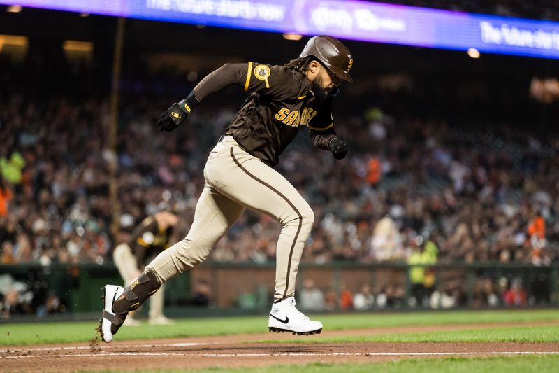 Sep 27, 2023; San Francisco, California, USA; San Diego Padres right fielder Fernando Tatis Jr. (23) grounds a single against the San Francisco Giants during the third inning at Oracle Park. Mandatory Credit: John Hefti-USA TODAY Sports